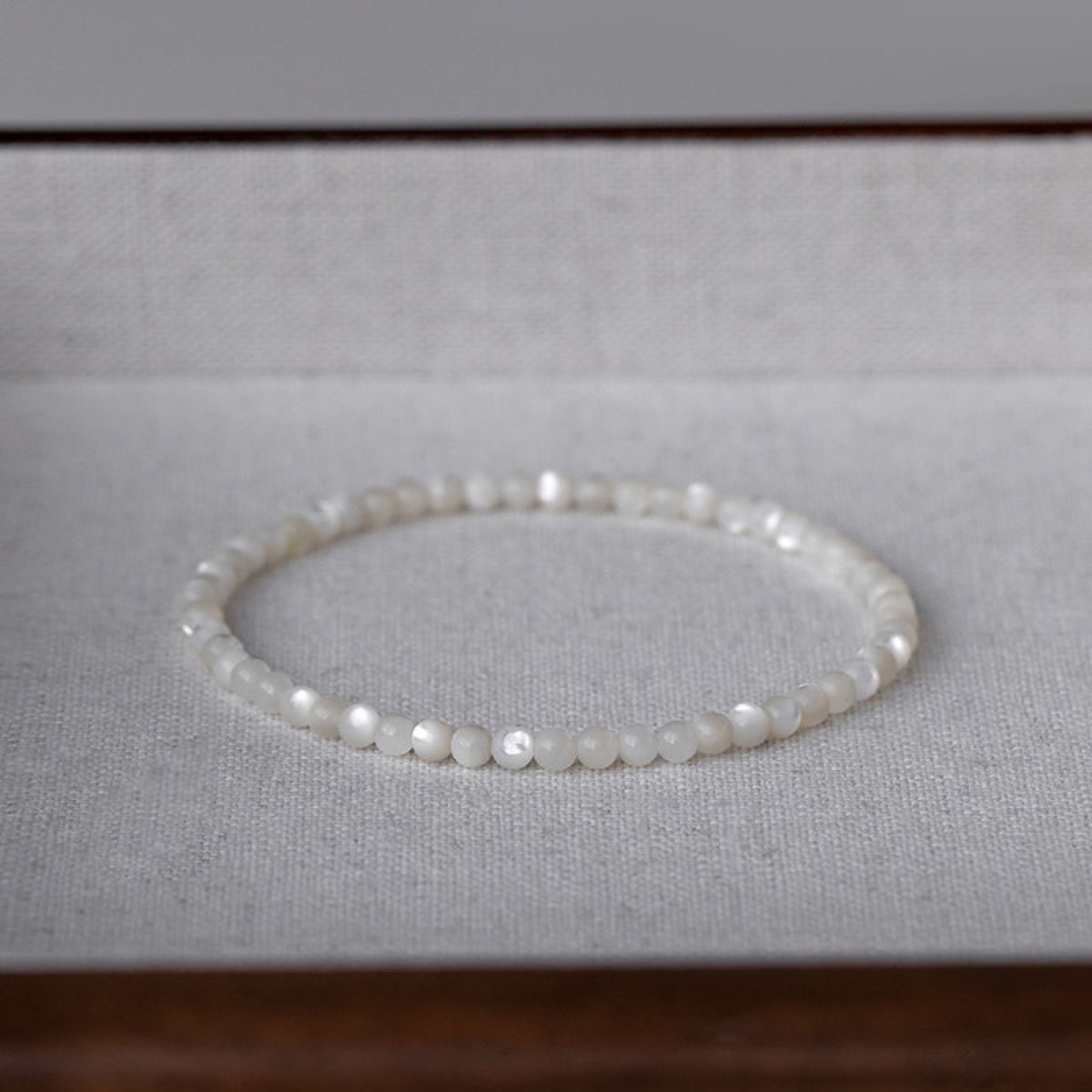 Lustre White Shell Bracelet flat lay detail thumbnail