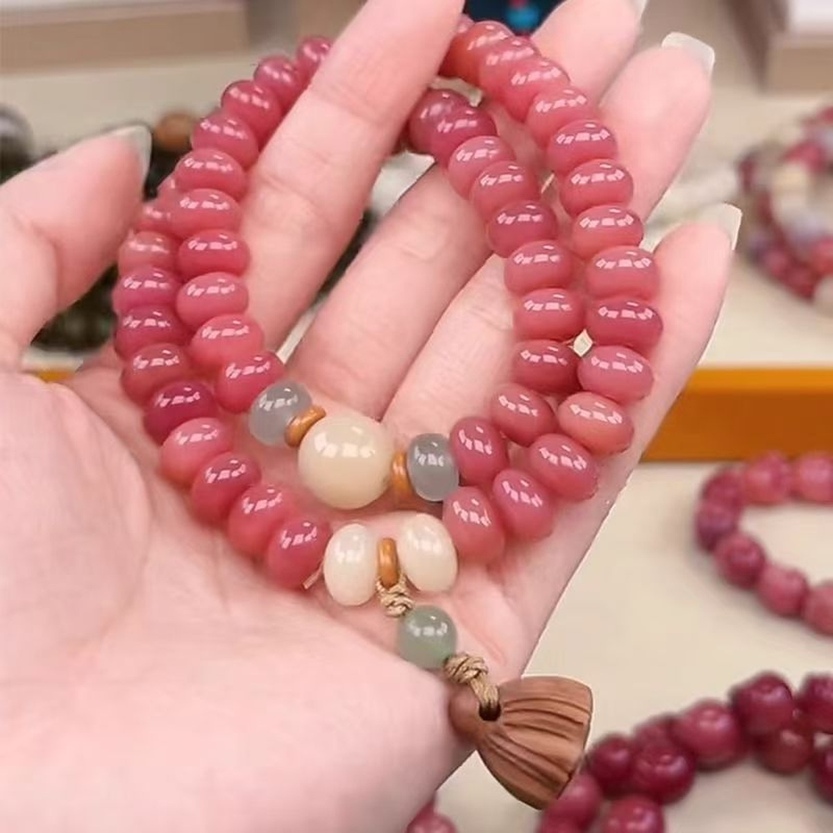 Blush Tassel Bead Bracelet flat lay detail thumbnail
